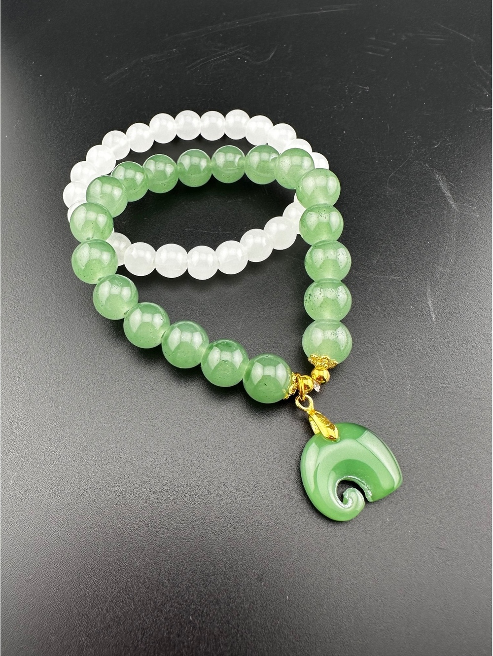 Set of Two Green and White Beaded Bracelets with Green Charm
